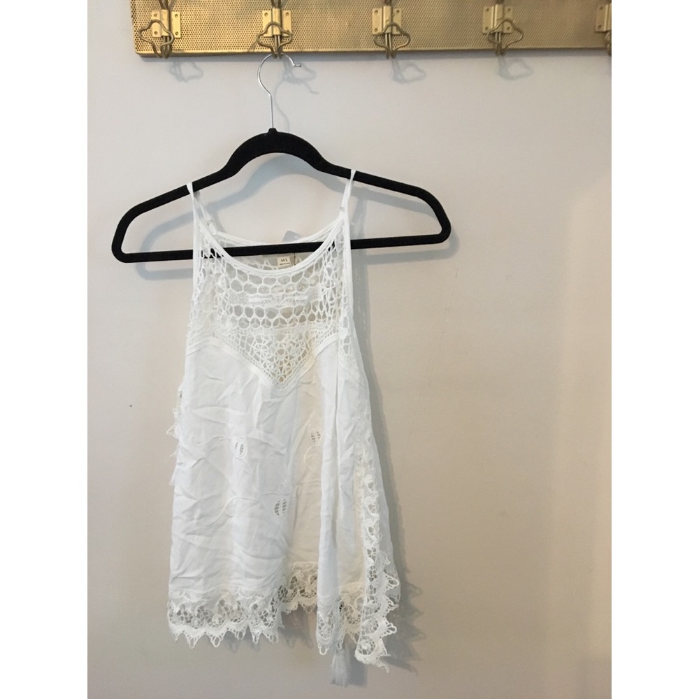 White tank with open sides.